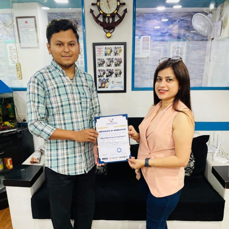 Trainer and student with course completion certificate