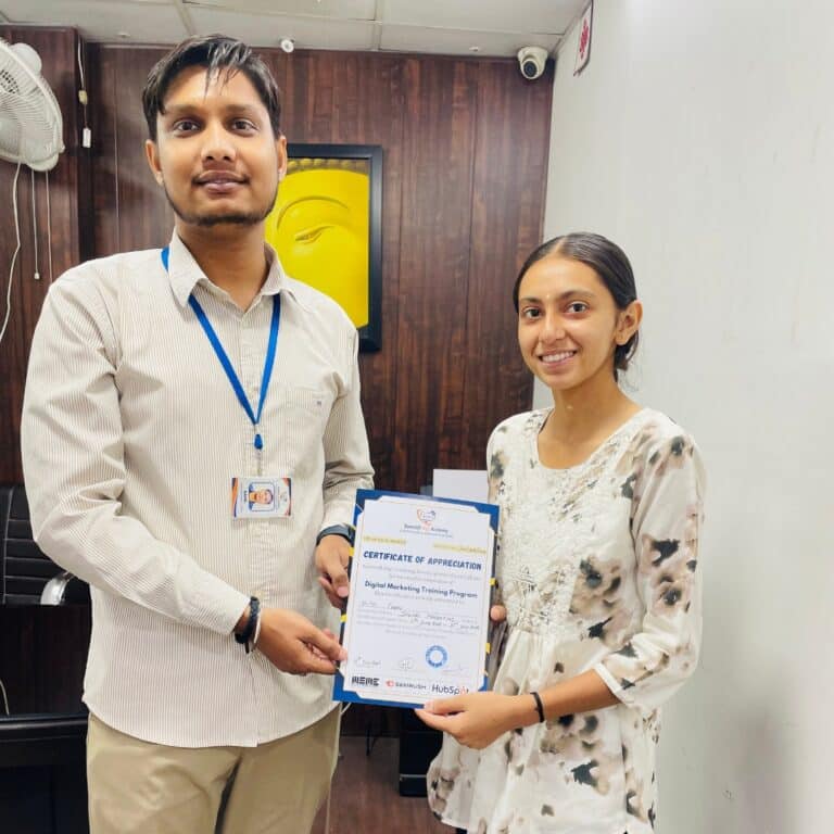 Trainer presenting digital marketing course certificate to student